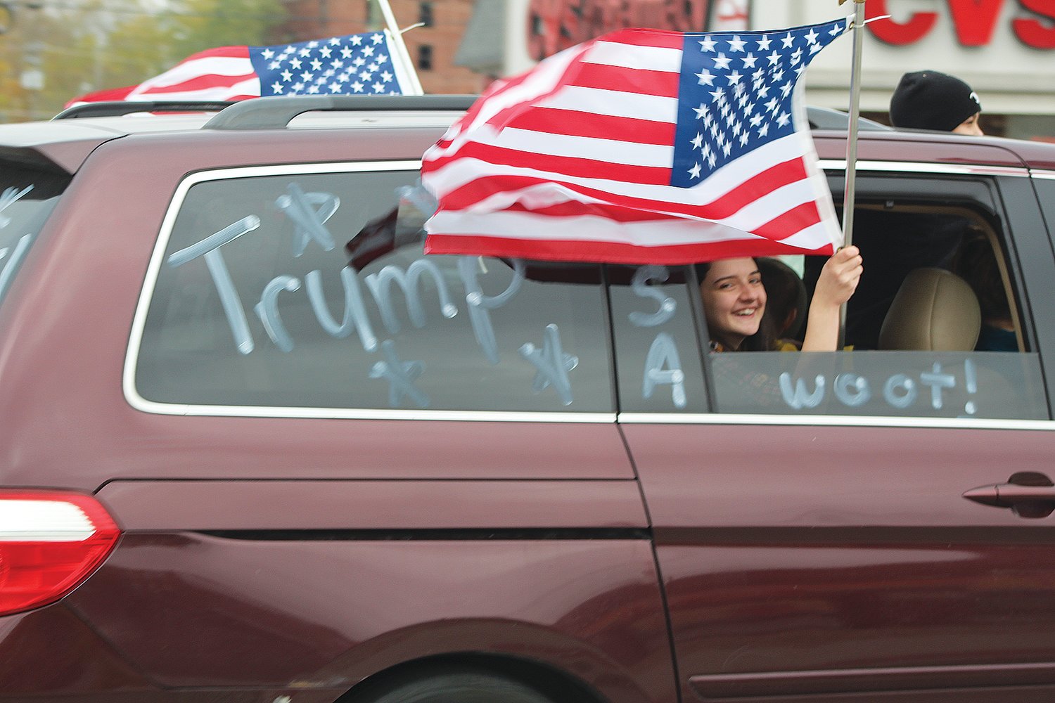 Cars and trucks adorned in patriotic colors, decorations and flags made their way through Crawfordsville on Sunday as part of an organized Trump Train event. Supporters of President Donald Trump honked their horns and chanted “four more years.”